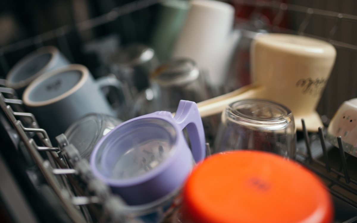 Open dishwasher drawer loaded with dishes, the kind of DishDrawer unit we repair in Walnut Creek homes