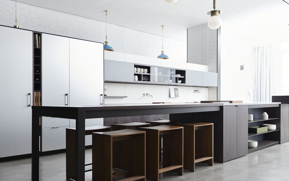 Professional-style range in a dark contemporary kitchen, of the kind we repair in Walnut Creek homes