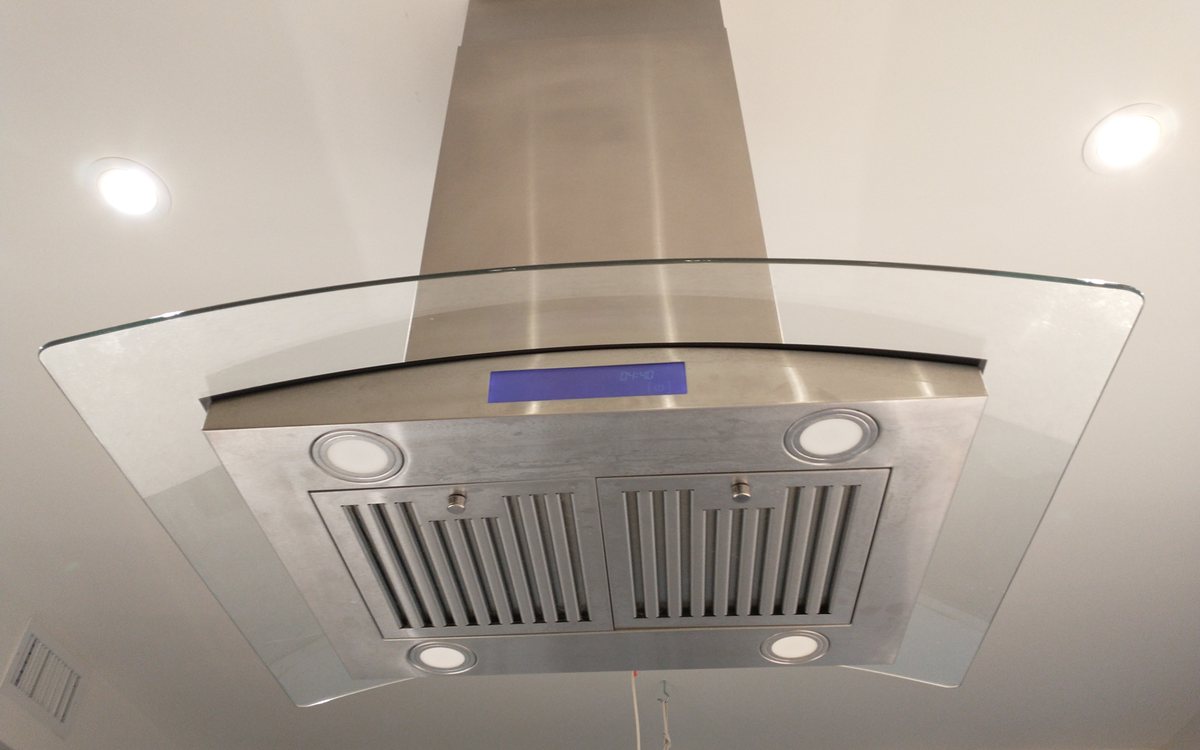 Stainless extractor hood above a cooktop, of the kind we repair in Walnut Creek homes