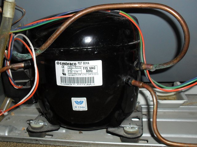 Compressor and refrigerant lines on a dual-refrigeration built-in unit