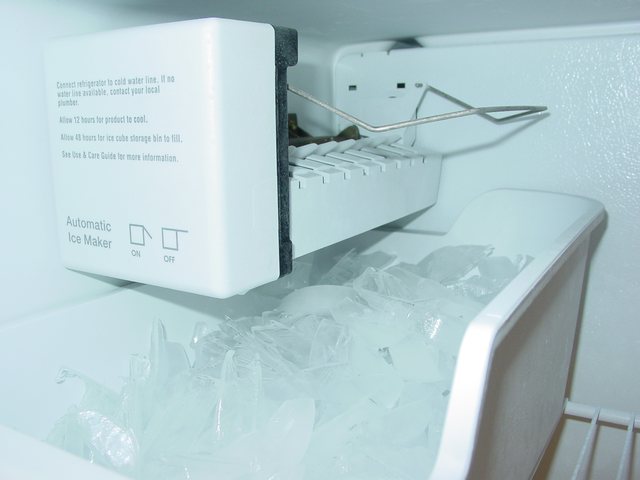 Ice maker module and bin in a built-in freezer compartment